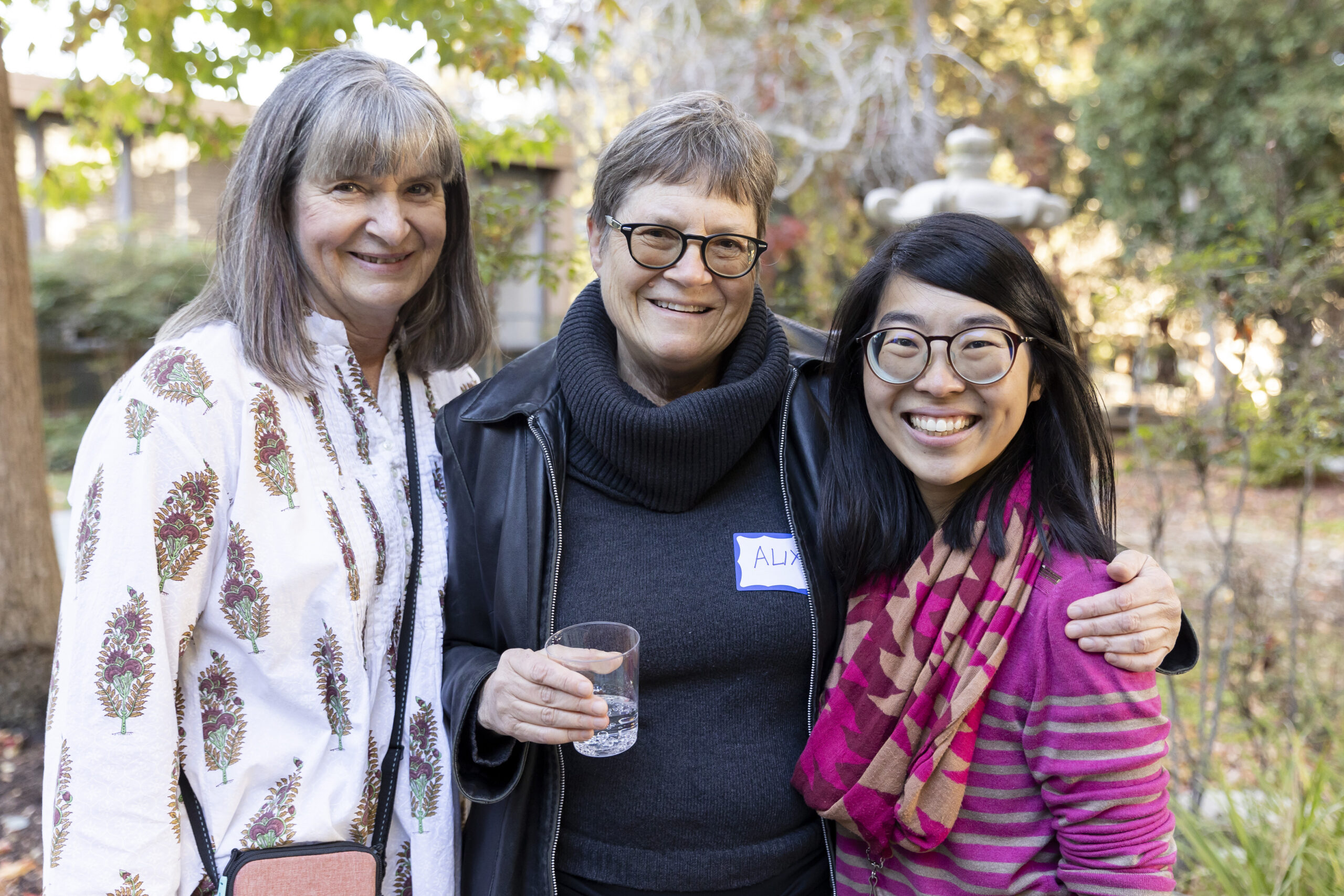 Three women smiling